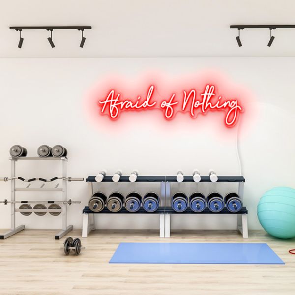 Afraid of Nothing CUSTOM NEON® pre-designed sign shown in red on gym wall