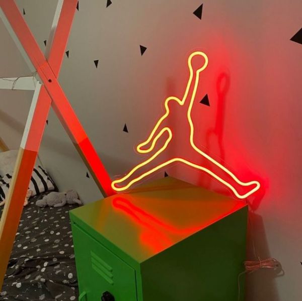 Basketball Legend Neon Art shown as children's room decor while illuminated - photo Custom Neon