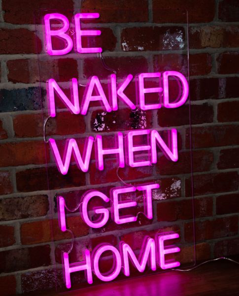 * Be Naked When I Get Home * sexy, ready to hang neon LED light sign on exposed brick wall  - photo from Custom Neon (formerly Neon Collective)