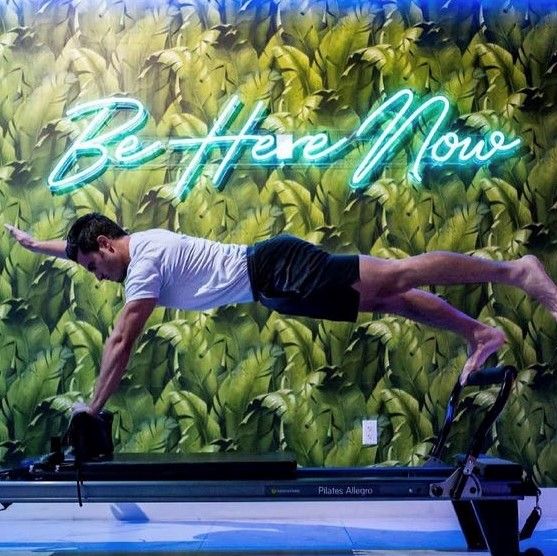 Be Here Now sign @sensory.fitness pilates studio made by CUSTOM NEON®