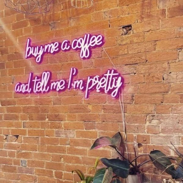 Buy Me Coffee and Tell Me I'm Pretty pink CUSTOM NEON® sign on brick wall @csc_dubbo