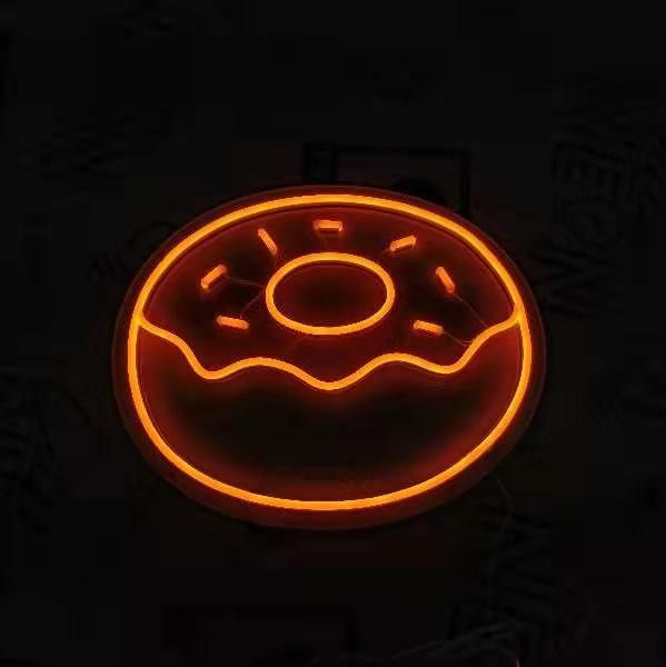 Orange donut with sprinkles LED neon sign shown turned on - made by Custom Neon®