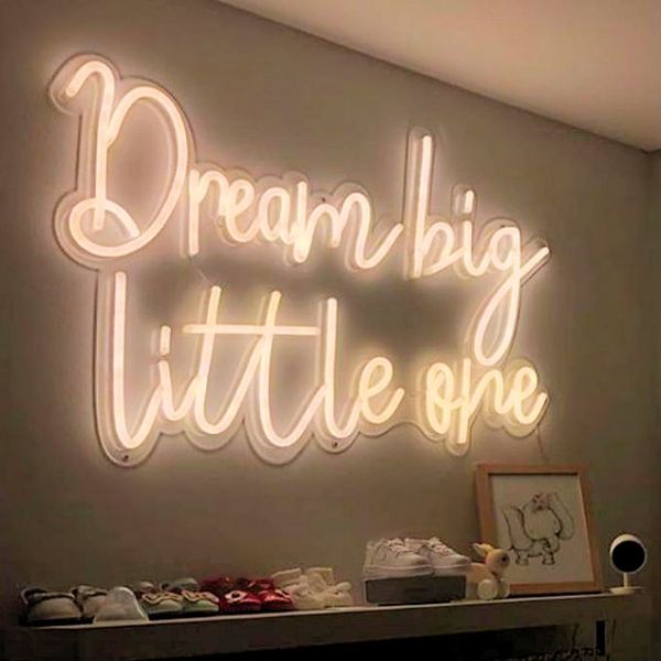 Dream Big Little One Neon Word Art in white in a children's clothing store - from Custom Neon