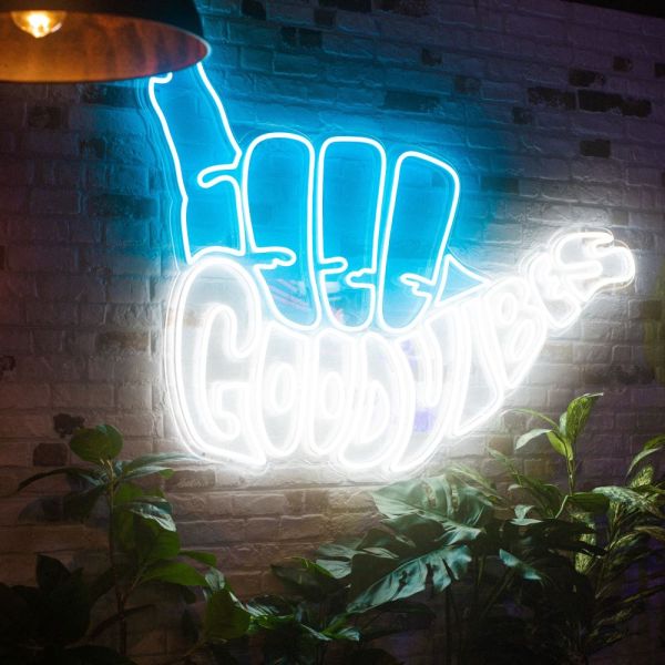Good Vibes Hang Ten Custom Neon sign on brick wall @marketplacevauxhall in London UK