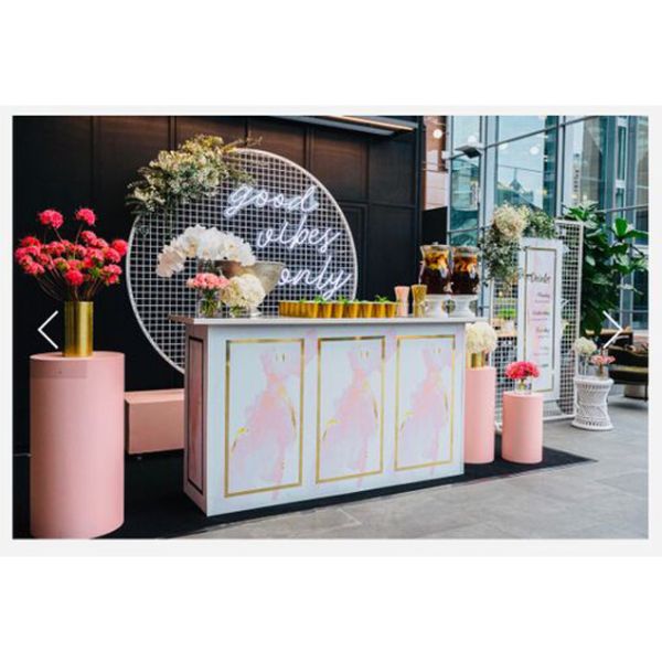 Good Vibes Only LED neon sign in 3 pieces shown behind the bar at an event - photo from CustomNeon.com.au