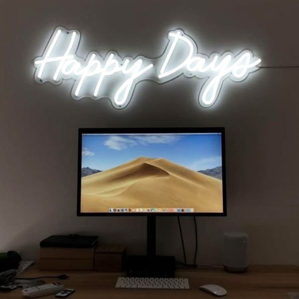 Happy Days LED neon sign shown illuminated above a monitor - photo CustomNeon.com.au