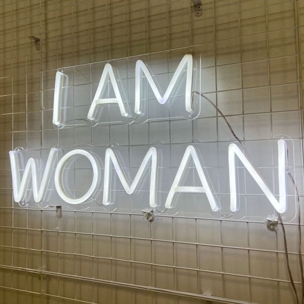 I Am Woman white Custom Neon® sign on wire frame