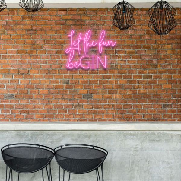 Let the Fun beGIN LED bar light in pink mounted on a brick wall at a bar - from Custom Neon