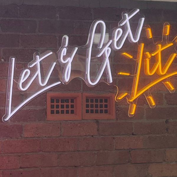 Let's Get Lit white & yellow Custom Neon® sign