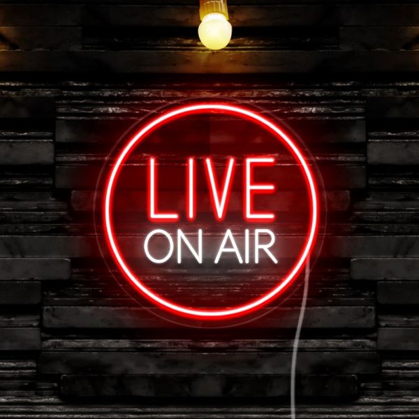 Live on Air studio sign by CUSTOM NEON® in white and red against a black stone wall