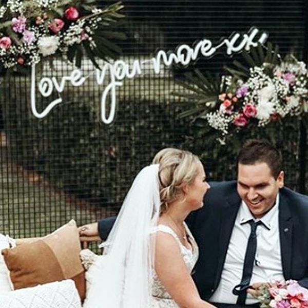 Love you more xx LED neon flex sign shown at a wedding - from Custom Neon®