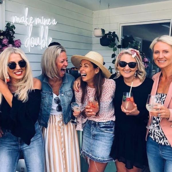 Make Mine a Double LED neon sign wall mounted outside for a party - photo from CustomNeon.com