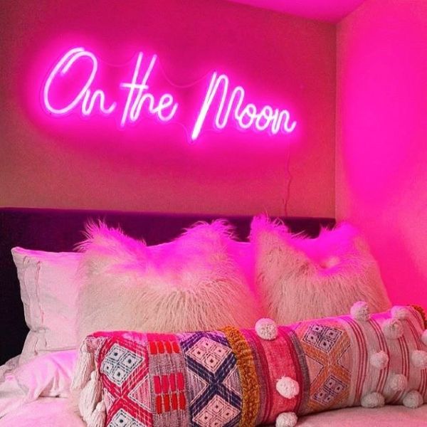 On the Moon neon light in pink shown on a bedroom wall - from Custom Neon