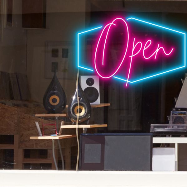 LED neon flex open sign shown in bright pink and blue with the WildSpirit font - from CustomNeon.com.au