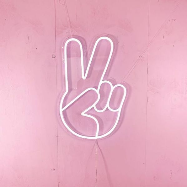 LED Neon Peace Emoji Sign Light shown on a pink wall - Photo CustomNeon.com.au