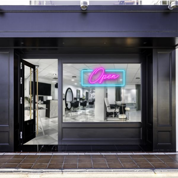Pink open sign with a blue rectangular shown lit up on the window of a beauty salon - photo CustomNeon.com.au