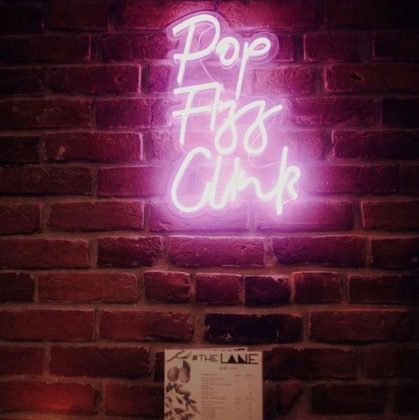 Pop Fizz Clink pink light sign as seen @down_thelane by Custom Neon