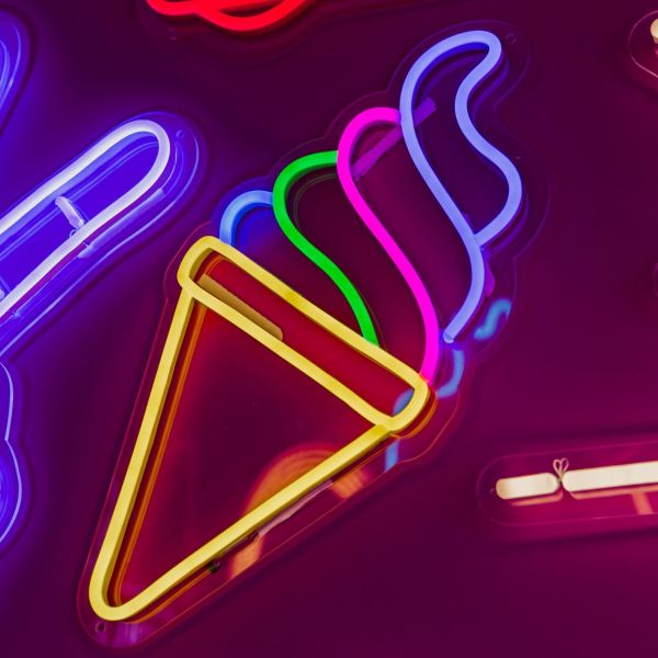 Custom Neon® Soft Serve Ice Cream Light Sign shown illuminated against a dark background in dim light 