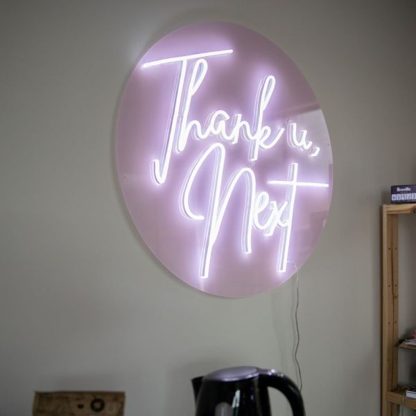 Thank U, Next Custom Neon® sign on pink acrylic backboard