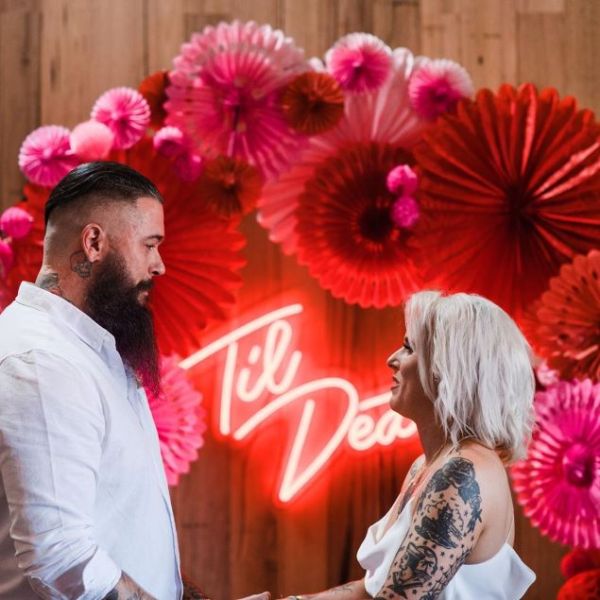 Til Death white neon flex sign as a focal point during a wedding ceremony - from Custom Neon