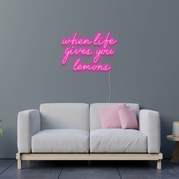 When Life Gives You Lemons pink neon flex sign wall mounted above a sofa - design by Custom Neon