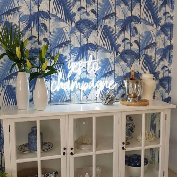Yes to Champagne Neon Sign shown atop a sideboard - photo from CustomNeon.com.au