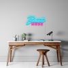 Beast Mode CUSTOM NEON® Sign in blue & pink wall mounted above a desk