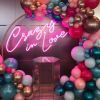 Crazy In Love Wedding Sign in brilliant LED neon flex shown in pink with balloons - photo from Custom Neon @customneon