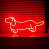 Dachshund LED Neon Art shown in red on a shelf  - from Custom Neon by Neon Collective