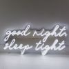 Good Night Sleep Tight white LED on silver mirrored backing shown in dim light - CUSTOM NEON® 