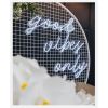 Good Vibes Only LED neon sign in 3 pieces shown on a mesh screen at an event - photo from CustomNeon.com.au
