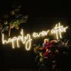 Happily Ever After LED neon sign surrounded by floral decorations - from Custom Neon®
