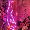 Holding hands in pink and red LED neon flex made by @customneon, styled for a wedding @thewarehousegeelong @theposieplace
