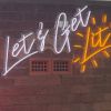 Let's Get Lit white & yellow Custom Neon® sign