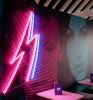 Lightning Bolt Neon Wall Art shown here on wall of a restaurant
