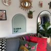 Listen Up! white & green neon art shown turned off & wall mounted above a sofa @customneon Signs of Change charity range