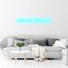 Miami Beach Light Sign by CUSTOM NEON® shown in ice blue against white wall in Hampton's style living room
