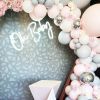 Oh Baby trendy baby shower sign shown surrounded by balloons - photo from Custom Neon by Neon Collective