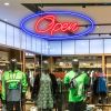 Two colour LED neon open sign using the Alexa font shown close up in clothing store window - from CustomNeon.com.au