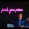 Pick Your Poison LED Neon Bar Sign shown above the bar at a party - from CustomNeon.com.au
