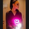 Handheld LED Neon Flower Bouquet held by a bride in her dressing room - photo from Custom Neon by Neon Collective