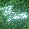 Til Death Neon Sign in LED flex shown in bright white on a green wall - photo CustomNeon.com.au