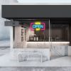 WE'RE OPEN 24/7 neon sign in yellow, blue & pink shown in a cafe window - from CustomNeon.com.au
