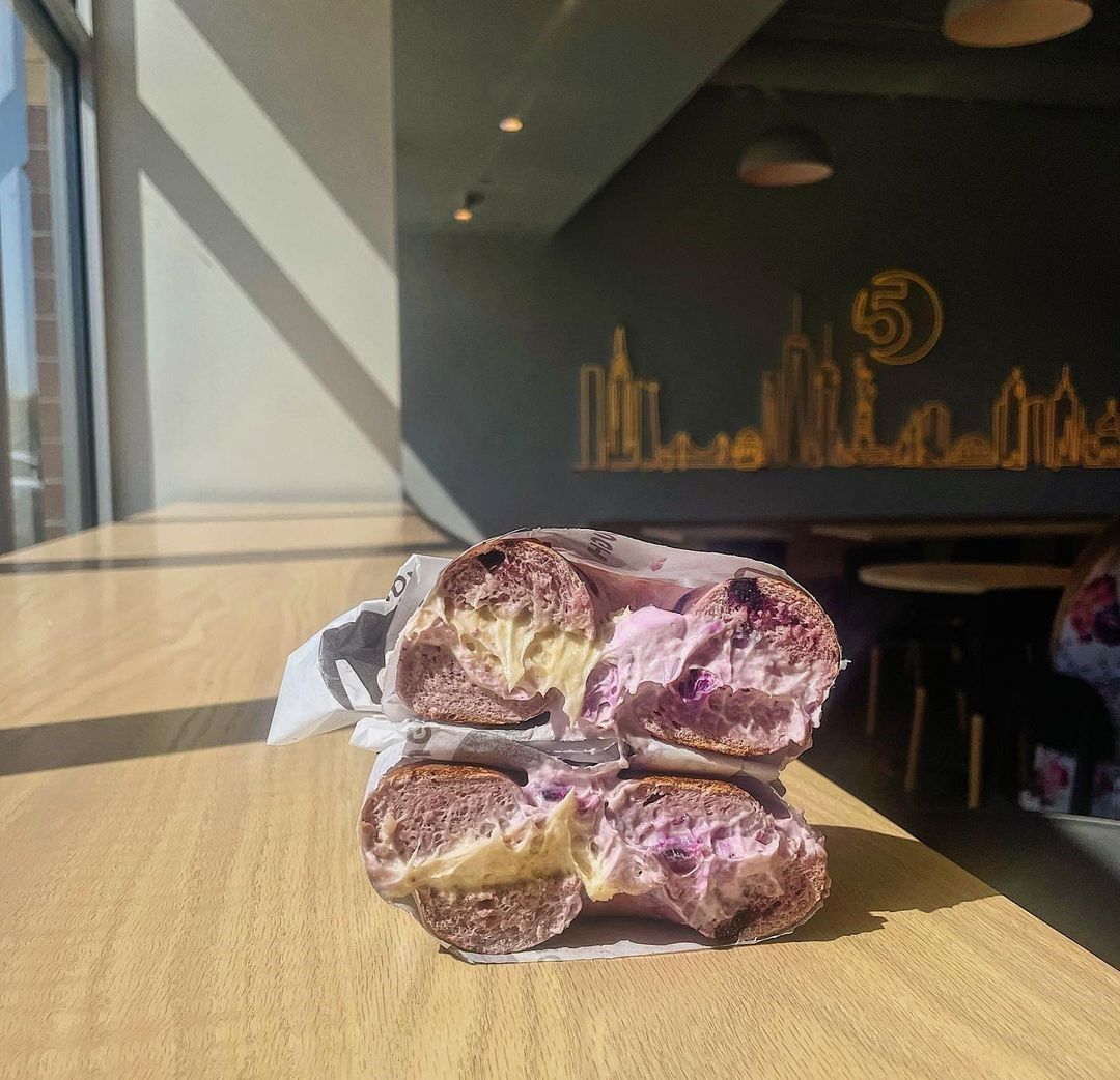 Warm white Custom Neon® artwork of the NYC skyline @5boroughbagels