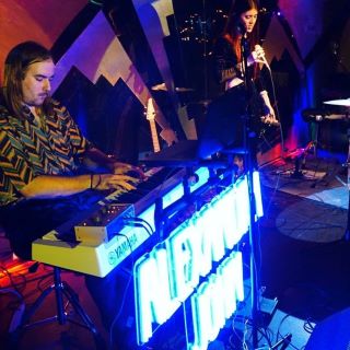 Blue Custom Neon® performing artist sign @alexandrajohnmusic