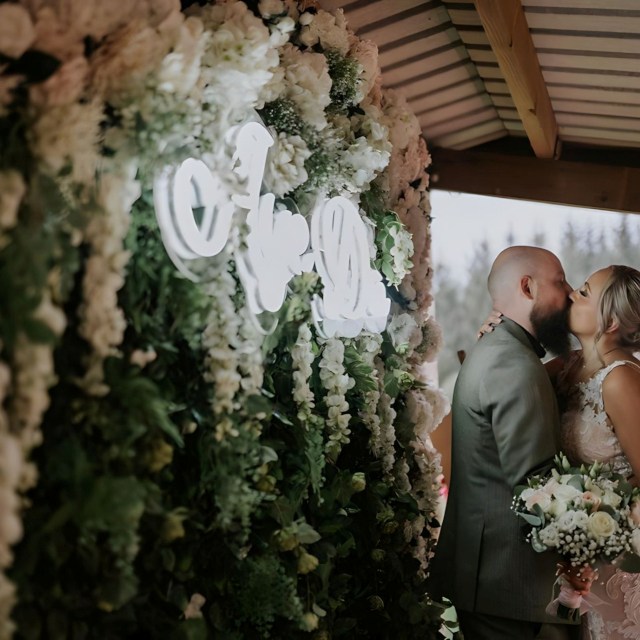Aye Do white Custom Neon® on lush floral wall @edenleisurevillage