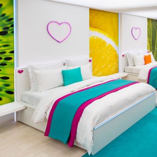 Custom Neon® pink hearts in the bedroom of the Love Island Australia Villa