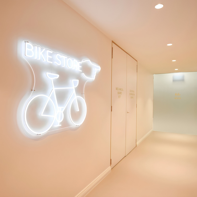 Custom Neon® white Bike Store wayfinding sign @475victoriaave @inoneprojects