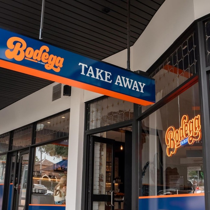 Custom Neon® storefront window logo sign @bodegaonhigh