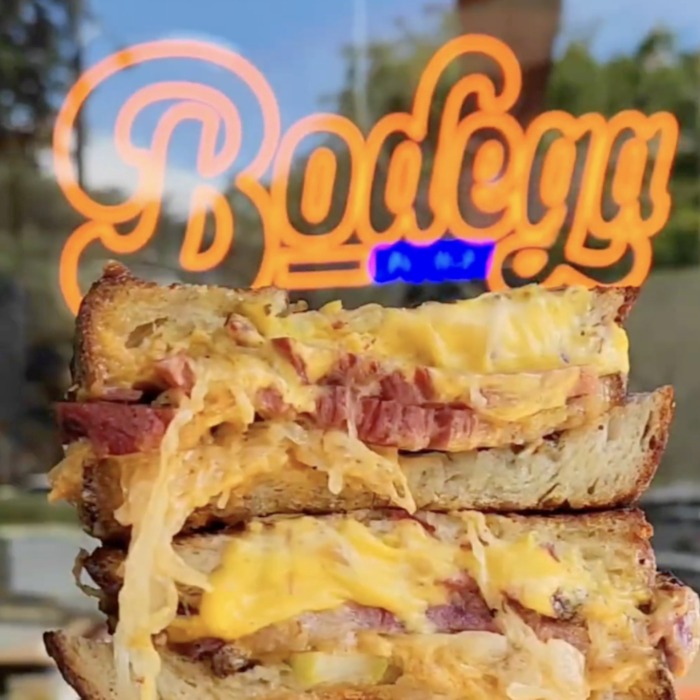 Custom Neon® storefront window logo sign @bodegaonhigh